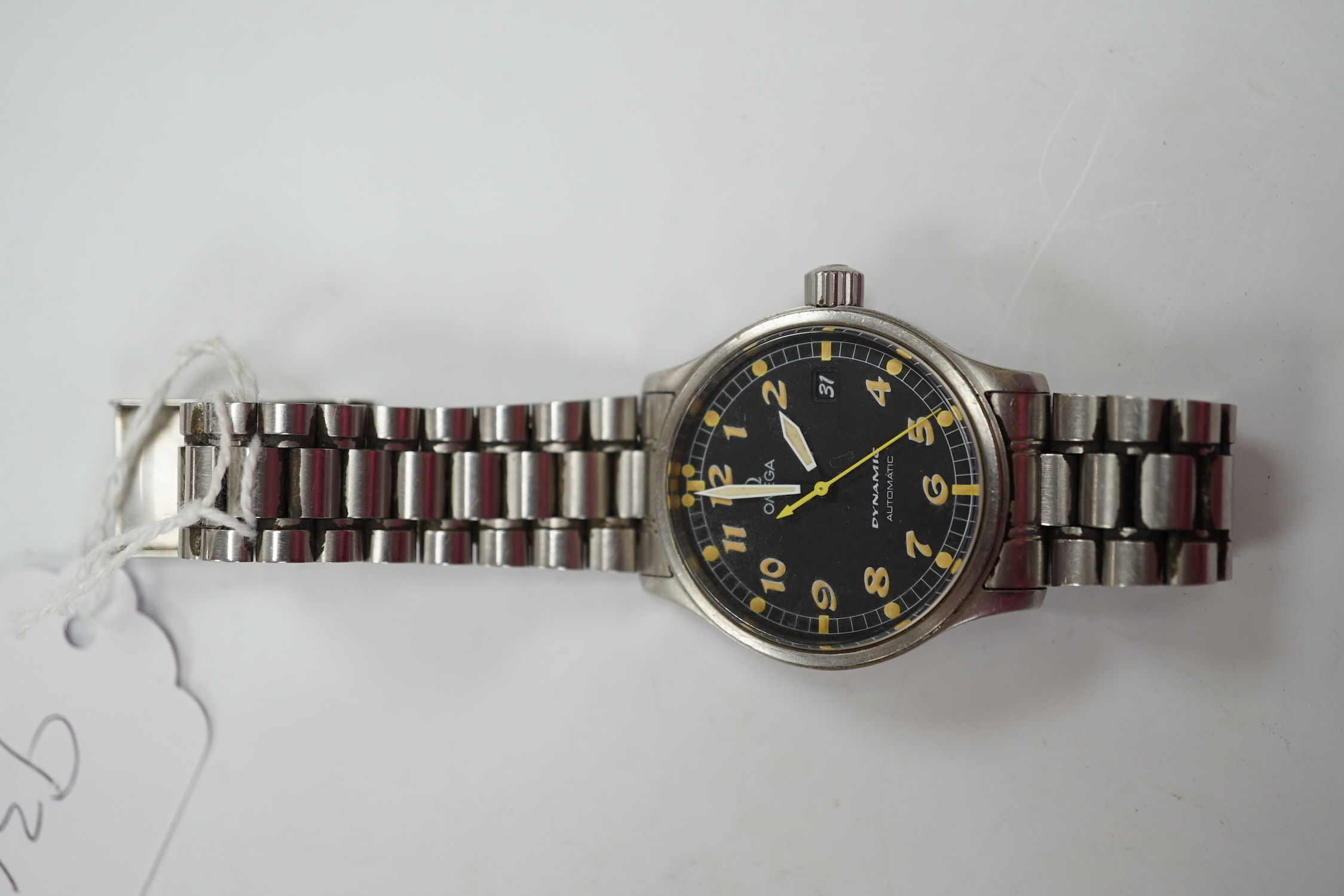 A gentleman's stainless steel Omega Dynamic automatic wrist watch, with black dial and date aperture, on a stainless steel bracelet, no box or papers, case diameter 37mm.